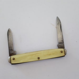 Vintage Camco (Camillus Cutlery) two blade advertising promo pocketknife, 1950's with celluloid scales, worn out ad