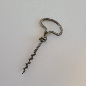 Antique steel wire handled corkscrew, probably dates to 1920&#39;s, not marked good condition measures 5 1/4&quot;