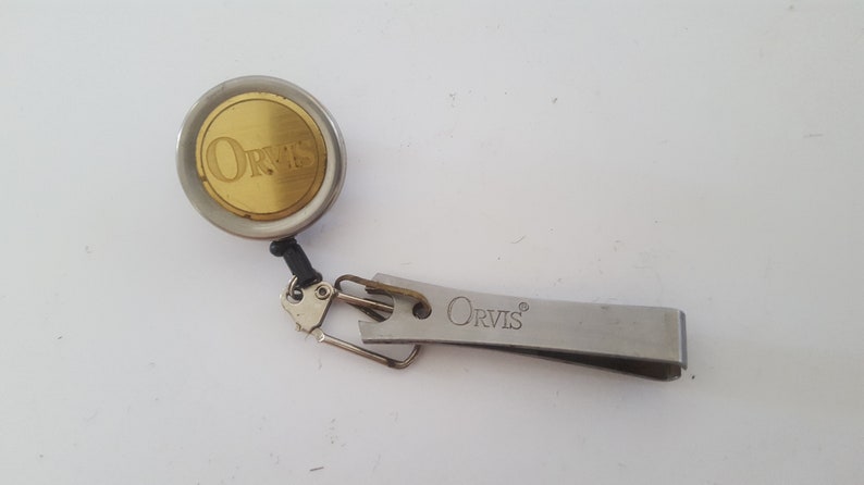Japanese stainless steel brass badge Vintage Circa 1980/'s Orvis flyfishing nippers on retractable pin