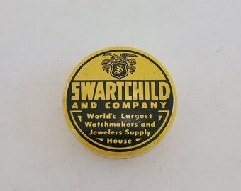 Vintage Swartchild & Co watch parts tin circa 1930's to 1950's empty in good graphic condition.