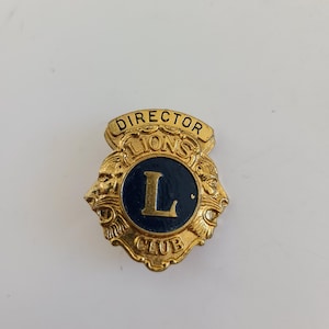 Vintage 1980&#39;s Lions Club Director lapel pin, gold tone measures 1 3/16&quot; has a hallmark for Leavens Mfg Co of Attleboro, MA.