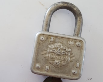 Vintage Master Lock Co. Lion&#39;s head/face , No.77, as found condition with original key, great patina,