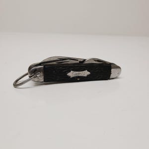 Vintage 1950's camp knife Camco (Camillus Cutlery Co). Camillus N.Y. 4 function Delrin scales that have shrunk,cleaned good condition