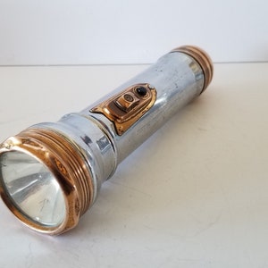 Vintage circa 1933 Winchester case no.1814 flashlight with copper switch, and caps excellent working condition takes 2 C cells not included.