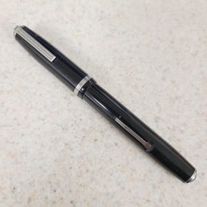 May include: A rustic wooden sign with the text "Welcome to our home" in white lettering. The sign features a distressed finish and a simple, inviting design, perfect for a front porch or entryway.