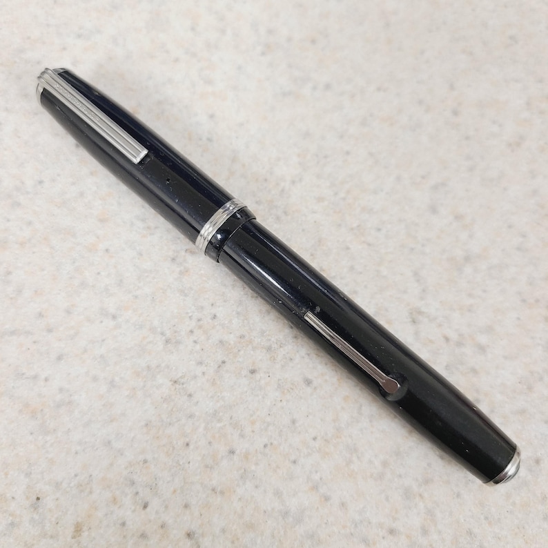 May include: A rustic wooden sign with the text "Welcome to our home" in white lettering. The sign features a distressed finish and a simple, inviting design, perfect for a front porch or entryway.