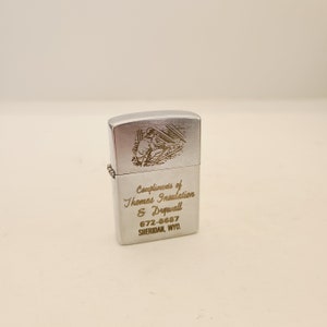 Vintage circa 1960&#39;s advertising cigarette lighter advertising Thomas Insulation & Drywall Sheridan, WY