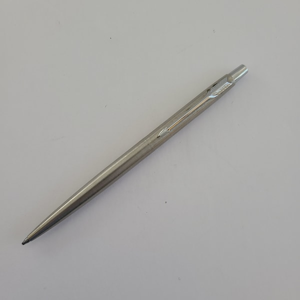 Vintage 1990 (date code Q) Made in USA Parker ballpoint pen in satin stainless steel finish, used but good condition, blue ink