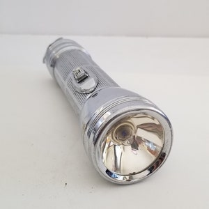 Vintage 1940 Bright Star model no. 516H flashlight works with 2 standard D cell batteries not included. New bulb, roll stop head,ring hanger