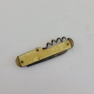 Vintage circa 1940's advertising Camco pocketknife,  knife, cap lifter and corkscrew, ad has worn off.