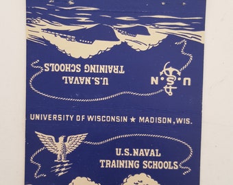 May include: A blue and white matchbook cover with the text "U.S. Naval Training Schools" and "University of Wisconsin Madison, Wis.". The cover features a white eagle with a rope border and a ship in the background.