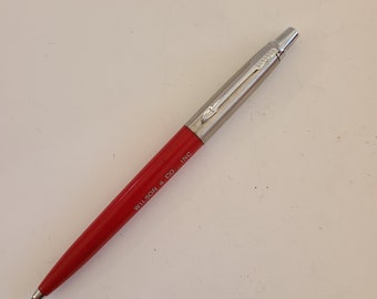 Vintage pre-1974  Made in USA Parker ballpoint pen in stainless steel cap red barrel, used but new blue medium refill ink "Wilson & Co. Inc"