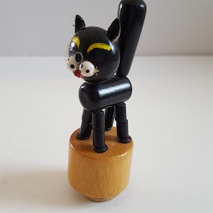 Vintage circa 1960&#39;s toy push up cat, black unmarked made of wood with leather ears, good condition