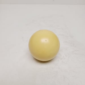 May include: A single, solid, pale yellow sphere. The smooth, round object is centered in the frame, with a slight sheen. The sphere appears to be made of a hard material.