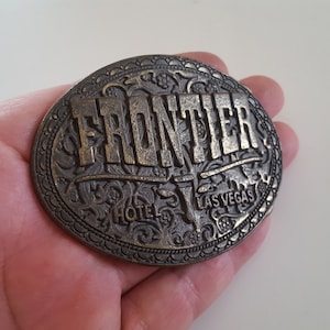 Vintage 1970&#39;s Frontier Hotel Las Vegas Nevada brass belt buckle.