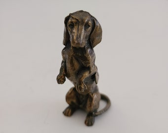 Vintage circa 1930's-1950's brass or bronze cast Dachsund souvenir of Cleveland O (Ohio) otherwise unmarked or signed, measures 2 1/8"