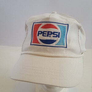 Vintage circa late 1980's Pepsi-Cola snapback golf cap in used condition, one size fits most