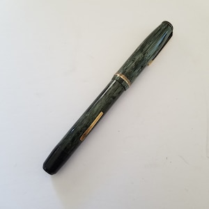 Vintage 1940&#39;s Wearever fountain pen celluloid funky design, dark/light green, small size measures 5 1/8&quot; untested but pliable bladder