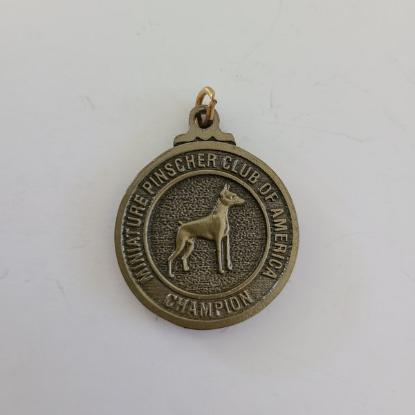 Vintage circa 2000 Miniature Pinscher Club of America "Champion" medal, no ribbon, not engraved 1 1/4" with bail