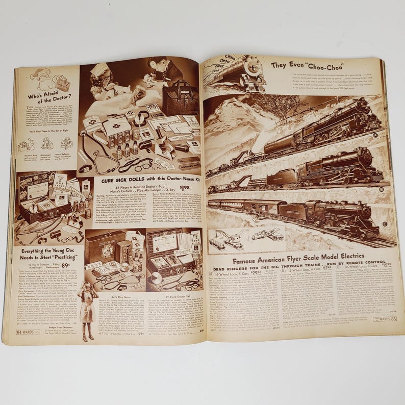 May include: A vintage magazine page featuring a doctor's kit and a toy train set. The doctor's kit includes a stethoscope, thermometer, and other medical supplies. The toy train set is a classic American Flyer model with a locomotive and several cars. The text on the page reads "Cure Sick Dolls with this Doctor-Nurse Kit" and "Famous American Flyer Scale Model Electrics".