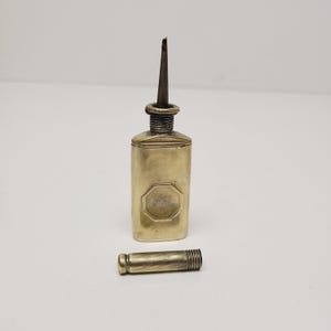 Antique circa 1905 firearms Oil can, brass nickel plate, with missing labels Measures 3 1/2&quot;, Winchester, Colt Made in USA