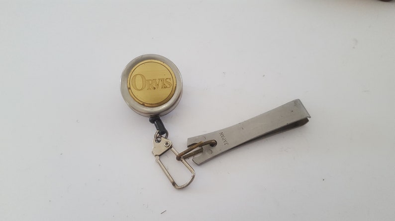Japanese stainless steel brass badge Vintage Circa 1980/'s Orvis flyfishing nippers on retractable pin