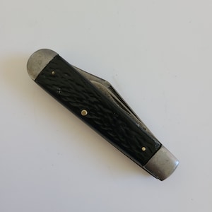 Vintage Camco Stockman 2 blade pocket knife with black Delrin scales, drop point, pen blades cleaned, edged