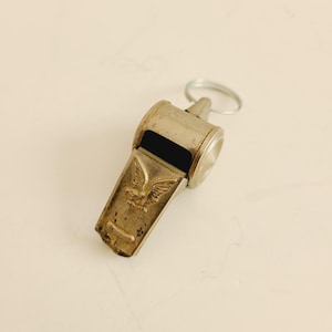 Vintage 1960&#39;s tin metal Whistle, debossed eagle design,  likely a child&#39;s toy from a junior detective set