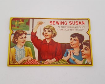 Vintage 1960's "Sewing Susan" 70 Gold Needles + threader, some missing, great graphics, needle book