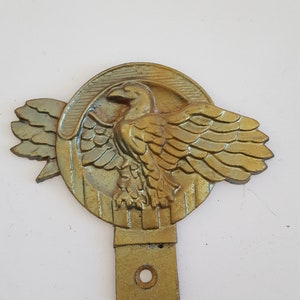 Vintage circa 1945 &quot;Ruptured Duck&quot; cast metal license plate topper, Honorable Discharge from Military service from WWII, 8th Army Air Corps