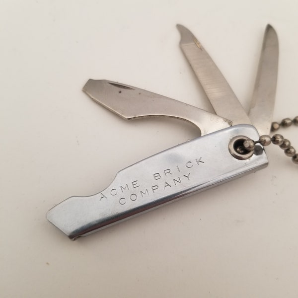 Vintage made in USA multi-tool  keychain advertising Acme Brick Company probably 1960's