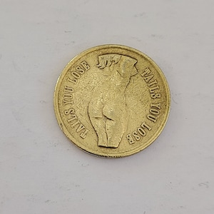 Vintage  novelty coin Heads I win, Tails you lose, brass, topless woman on heads side, bottomless on tails. well worn and polished