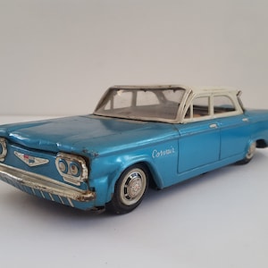 Vintage 1960s Chevrolet Corvair Tin Toy: Harasume Friction Sedan