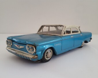 Vintage 1960s Chevrolet Corvair Tin Toy: Harasume Friction Sedan