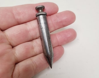 Vintage mid 20th Century small size all steel plumb bob, well used and unmarked measures 2 3/4"