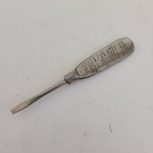 Antique circa 1920 advertising screwdriver "That Rudy Tire Service" nickel plate, good condition, Fort Wayne, Indiana