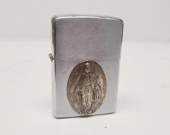 Vintage 1966 Zippo Windproof Lighter: Has a Mary Immaculate medal