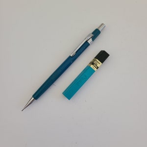 Vintage 1980&#39;s Pentel sliding sleeve P207 mechanical pencil in blue with pack of 0.7mm leads.