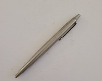 Vintage 1989 Parker Jotter ballpoint pen, arrow pocket clip, stainless steel finish, blue medium refill.