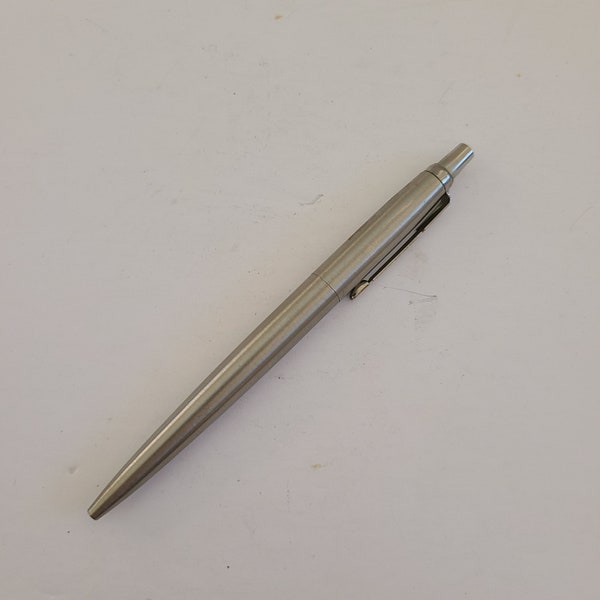 Vintage 1989 Parker Jotter ballpoint pen, arrow pocket clip, stainless steel finish, blue medium refill.