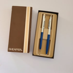 Vintage circa 1970 Sheaffer ballpoint pen and mechanical pencil set, original box with advertising, new condition pen needs refill