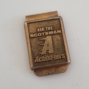 Vintage circa 1970&#39;s &quot;Ask the Scotsman Action-eers&quot; brass color steel money clip, no idea what company