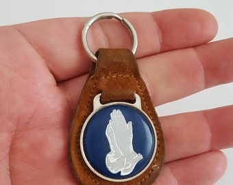 Vintage suede leather key ring praying hands emblem in center, used brown open grain leather Made in USA likely