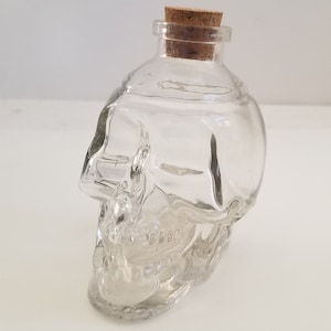 Vintage circa 2000 clear molded glass skull bottle with cork stopper, potion bottle 4x4x2