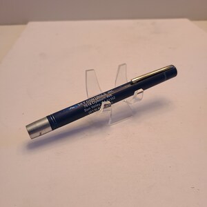 May include: A blue pen with silver accents and the text "SKY CONTROLS, INC. 7518 Clybourn Ave. Sun Valley, 91352 (213) 8703" printed on the side.