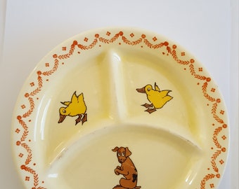 Vintage circa 1930's ceramic child's partitioned plate, decorated with ducklings and a puppy, glaze is crackled,  good condition