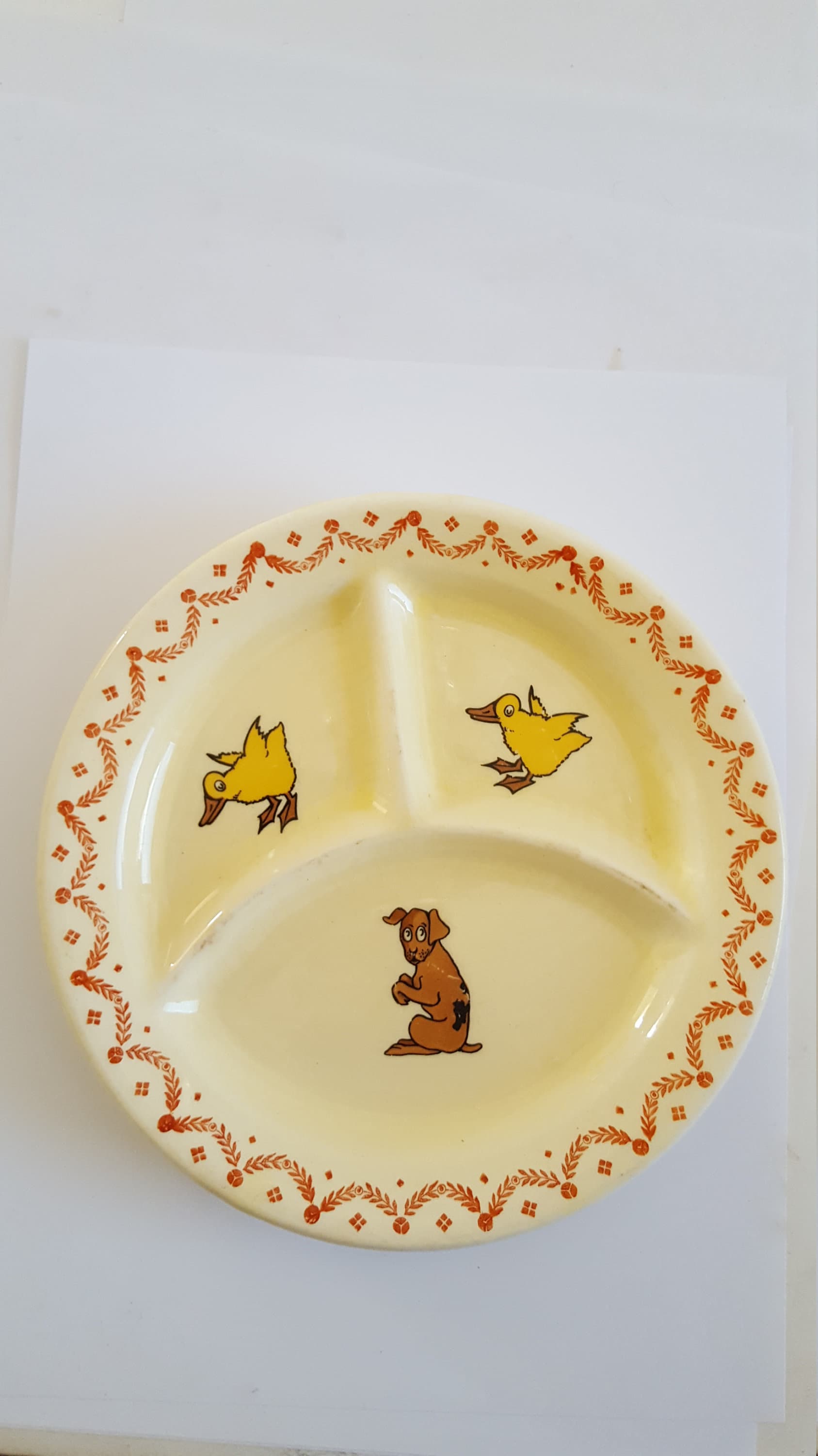 Vintage circa 1930's ceramic child's partitioned plate, decorated with ducklings and a puppy, glaze is crackled,  good condition
