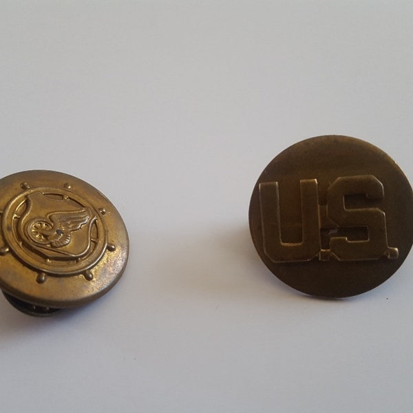 Vintage U.S.Army enlisted men's collar devices for Transport Corps, US disc and winged wheel on shield surrounded by ships wheel, brass