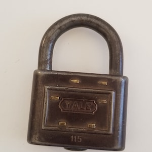 Antique early 20th century Yale No.115 six stamped steel padlock with steel shackle but no key, Stamford, CT