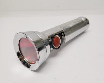 Vintage 1980 Energizer Eveready flashlight working condition with red push button switch, ring hanger, 2 D cell,  batteries not included